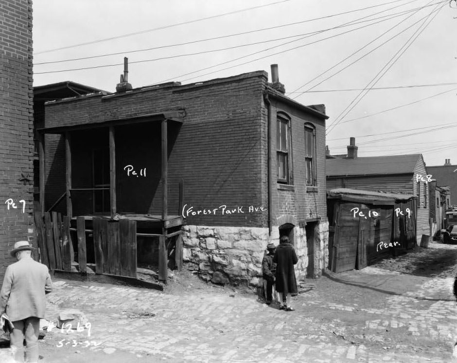 #44 View of three people in an alley off of Forest Park Avenue, 1932