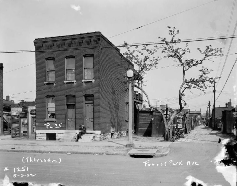 #223 View of man sitting on front steps of a building on Forest Park Ave., 1932.