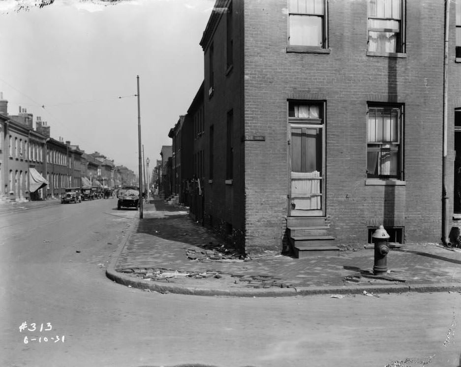 #228 View of intersection of Biddle St. and North 21st St., with house at 1130 North 21st St. in foreground, 1931.