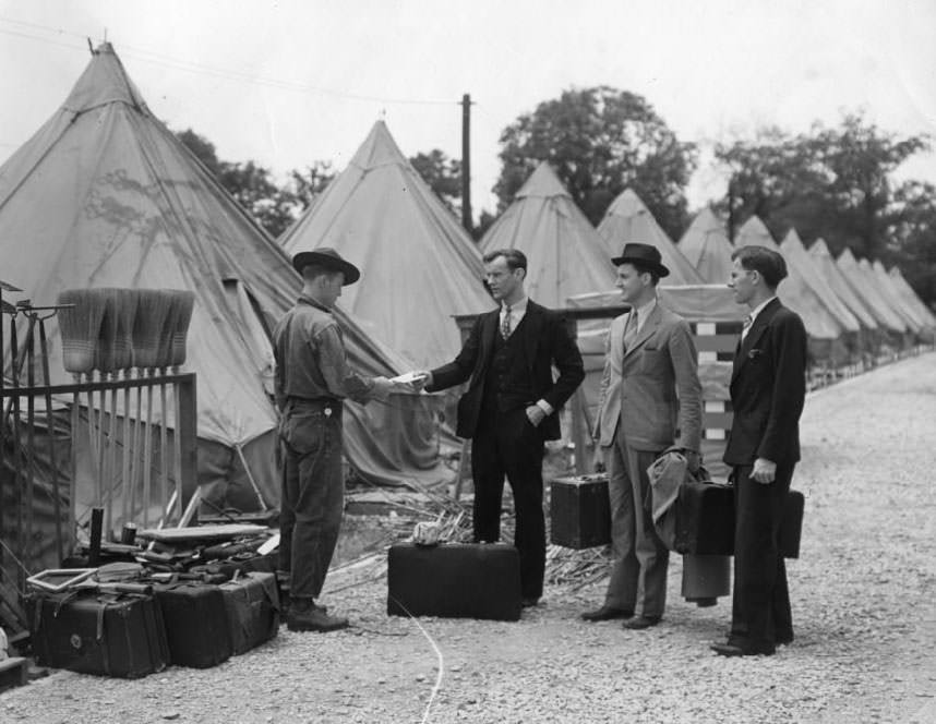 #92 Men in suits visit a man with either long legs or short pants in 1930.