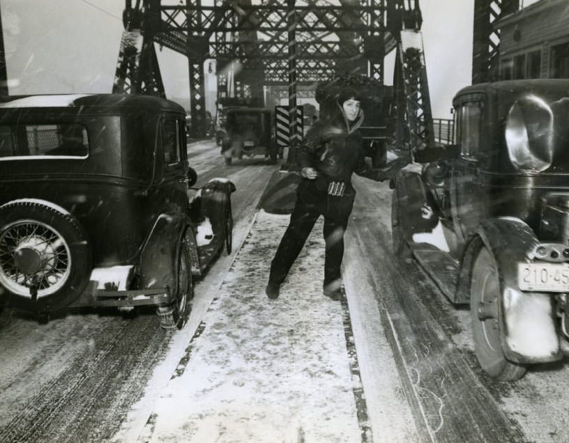 #204 Louis Lasser, 34-year-old MacArthur Bridge attendant, insists he has “easily the coldest job in St. Louis” despite his heavy clothing, 1930