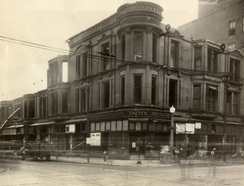#211 Three-story building at the southeast corner of Grand Boulevard and Olive Street being torn down to make way for a new two or three-story structure, 1930