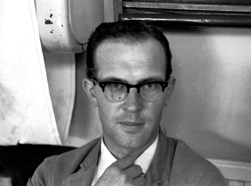 #12 Driver adjusts his tie, Paignton bus station, 1970