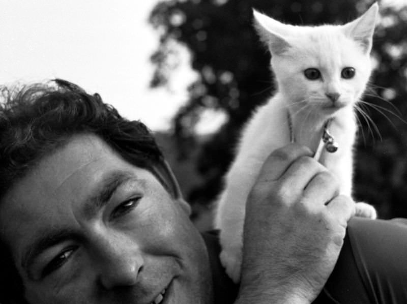 #2 A Western National bus conductor with a fluffy kitten on his shoulder, Totnes, Devon, 1970
