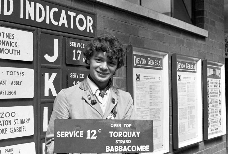 #39 War trophy – Devon General indicator board in the hands of a Western National conductor, Paignton bus station, 1970