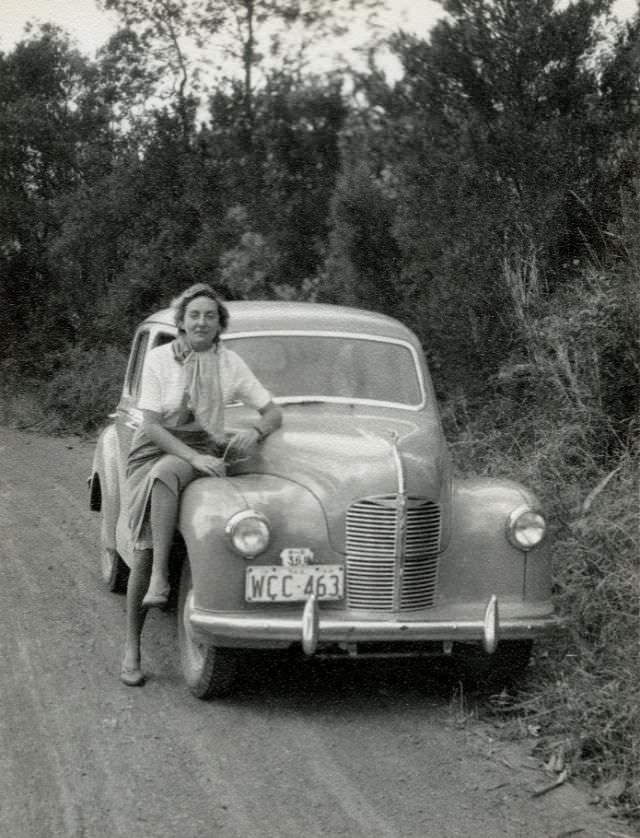 #11 Austin A40 Devon on a dirt road in the Australian countryside, 1954.