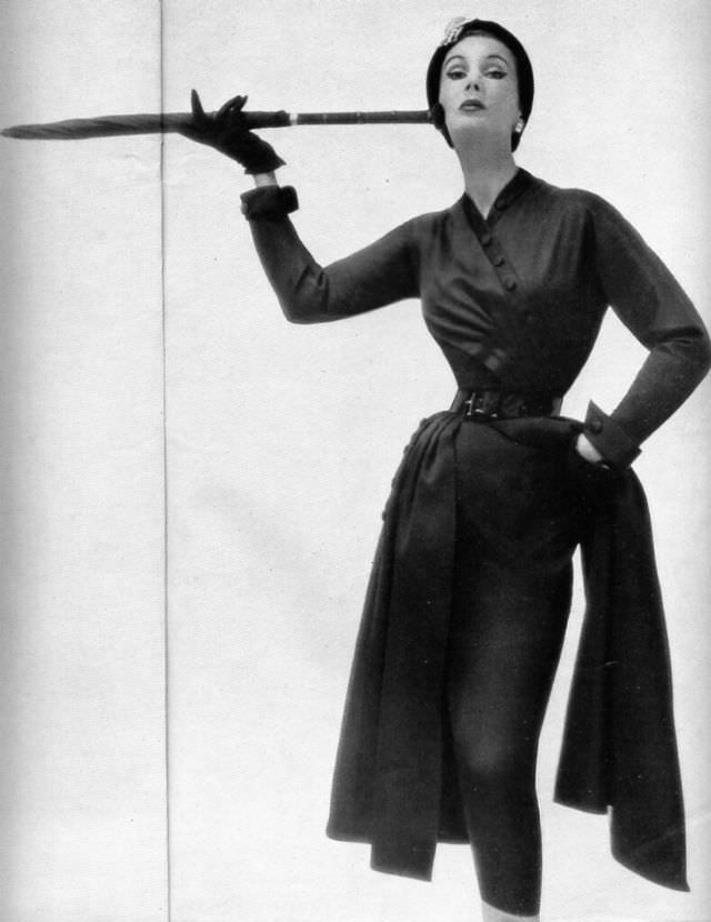 #1 Barbara Goalen in a form-fitting side-wrapped dress designed by Susan Small, 1950.
