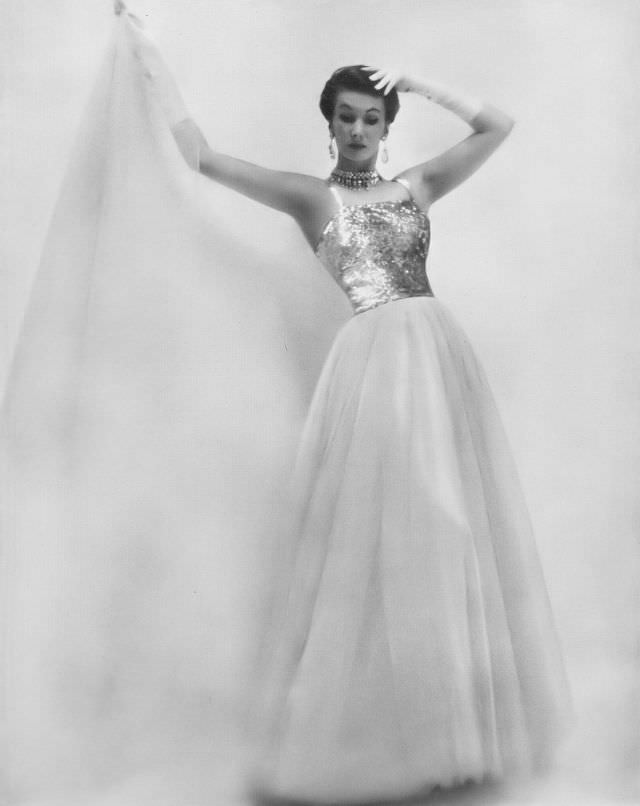 #2 Barbara Goalen in a beautiful tulle evening gown with glittering sequined bodice by Susan Small, 1950.