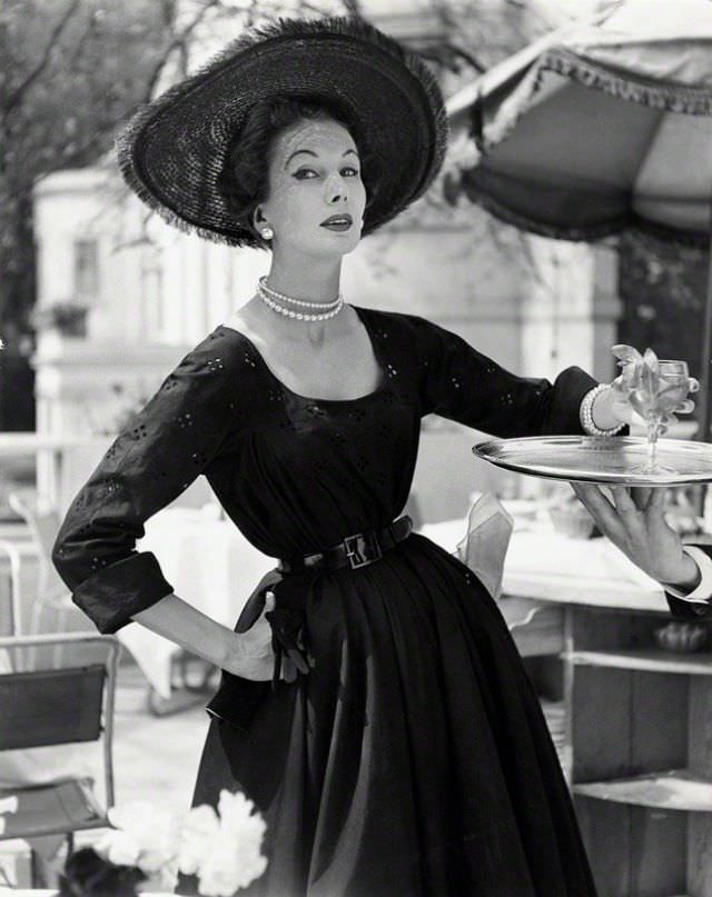 #29 Barbara Goalen in a Hardy Amies town dress, photo by John French for the Daily Express, London, 1952.