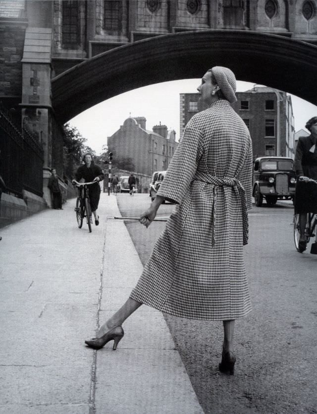 #41 Barbara Goalen in back-belted checked Donegal tweed coat by Sybil Connolly, photo by Milton Greene, 1953.