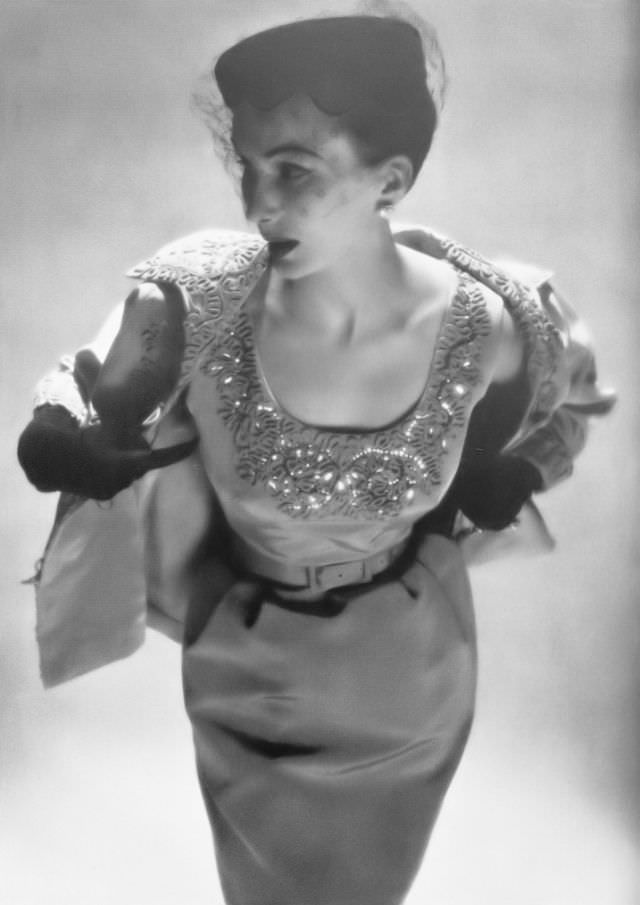 #46 Barbara Goalen in pale turquoise grosgrain dress and jacket embroidered with braid by Roecliff & Chapman, 1953.