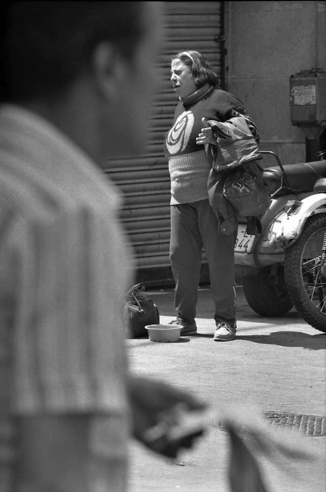 #26 Street singer, La Rambla, Barcelona, 1990.