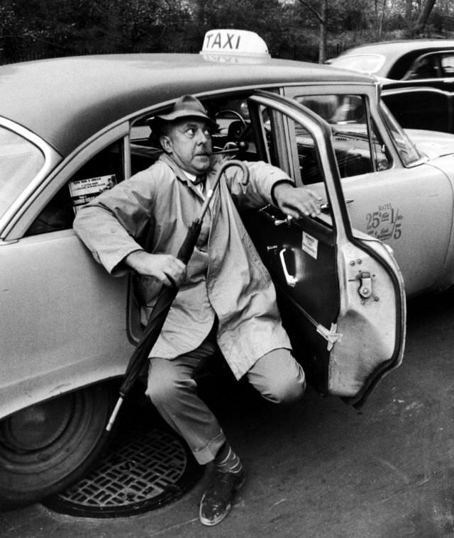 #19 French actor Jacques Tati in New York City, 1958.