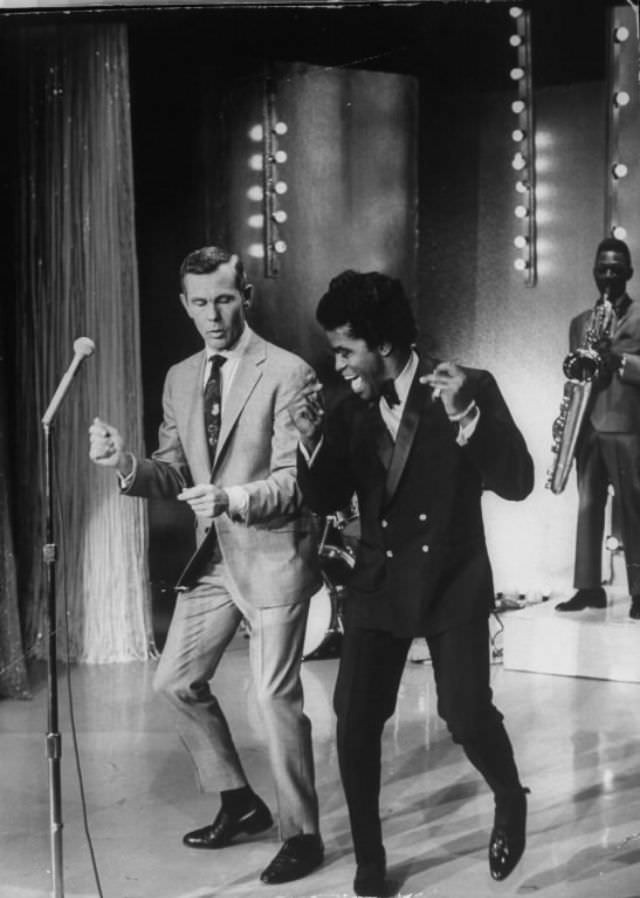 #29 Singer James Brown teaching talk show host Johnny Carson how to dance, 1967.