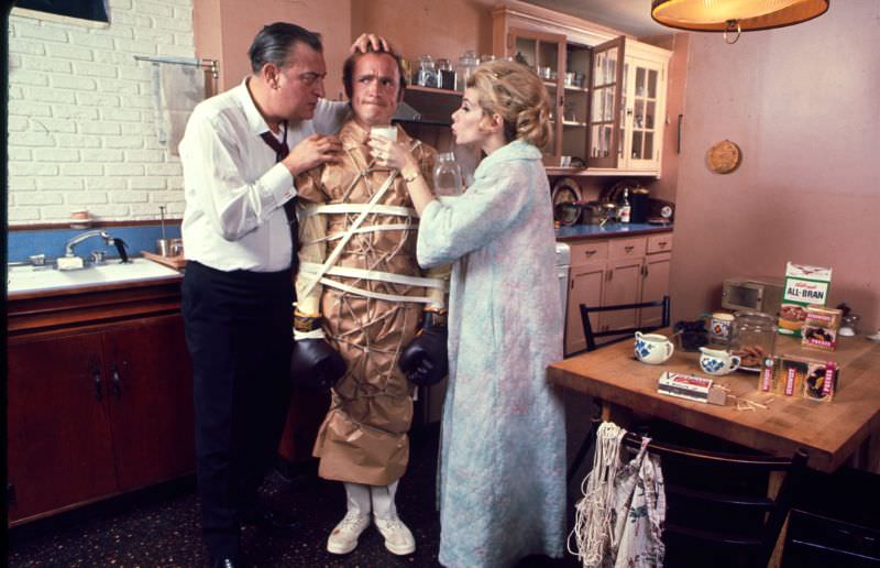 #30 Rodney Dangerfield and Joan Rivers wrapped up Dick Cavett in a scene from Portnoy’s Complaint, 1969.