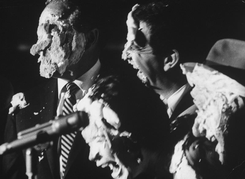 #4 Comedian Bob Hope with Soupy Sales and Shirley MacLaine, their faces covered with remnants of cream pies, 1962.