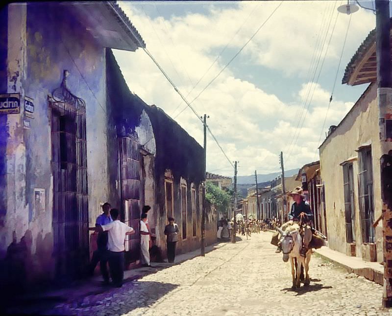 #10 Cobblestone street with old buildings, Cuba, 1950