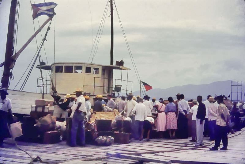 #21 People by the boat with baggage, Cuba, 1950