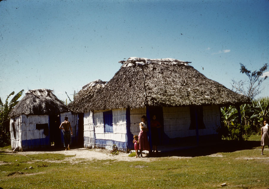 #12 House with thatched roof, painted blue and white