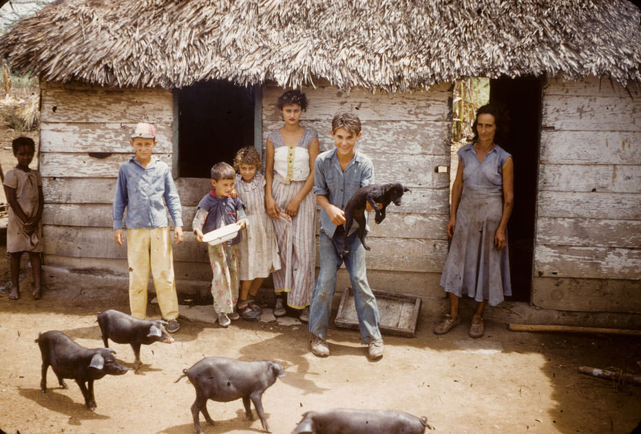 #3 Cuban children stand front of their house
