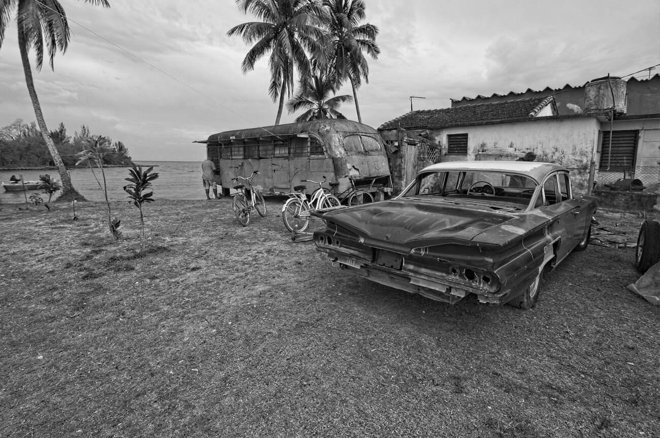#53 Plot of Land Beside House with Derelict Bus and Old American Car in Caleton, Cuba.