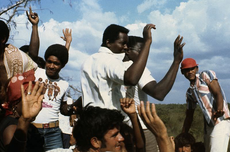 #29 Cuban men waving good-bye, Cuba, 1976