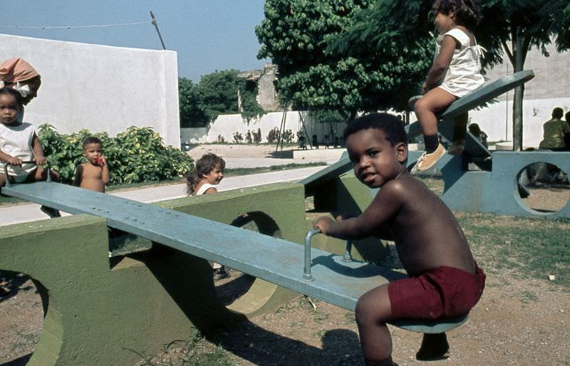 #43 Swinging in the playground of the nursery, Cuba, 1976