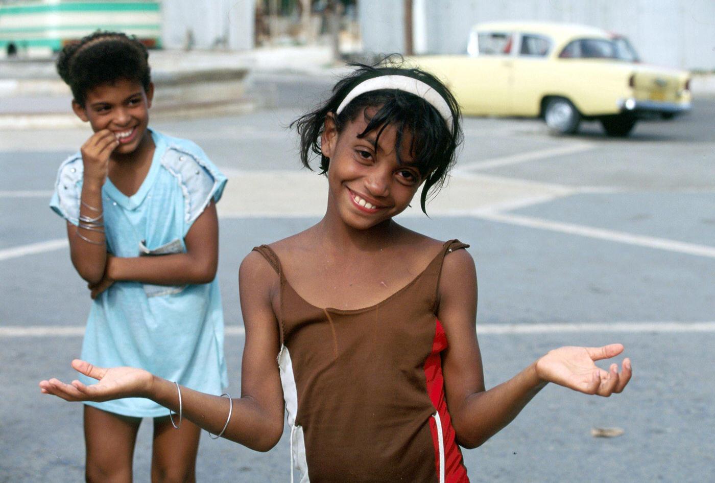 #36 Amused Cuban little girl posing in the street in Havana, Cuba, 1990.