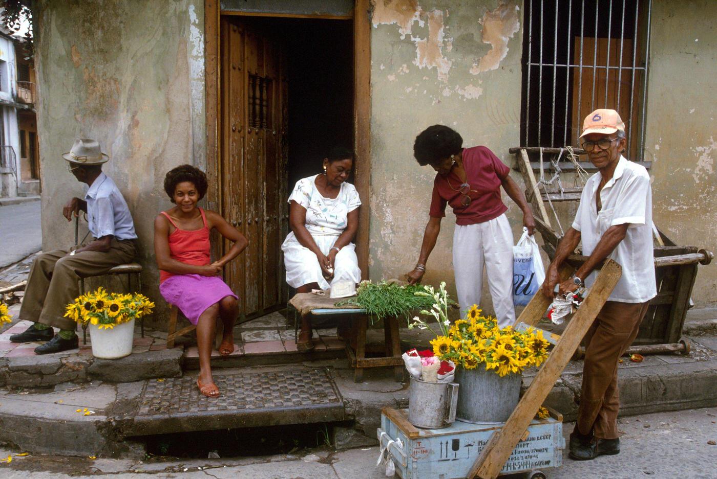 #51 Cuban people selling flowers at the entrance of their house, Cuba, 1990.