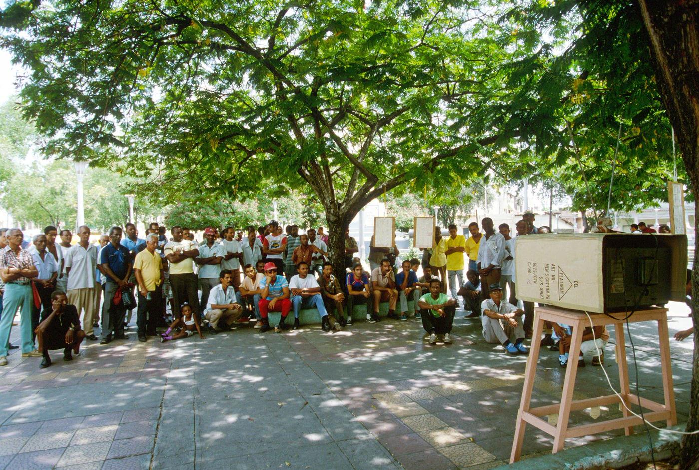 #52 Cuban people watching TV in the street in Santiago de Cuba, 1990.