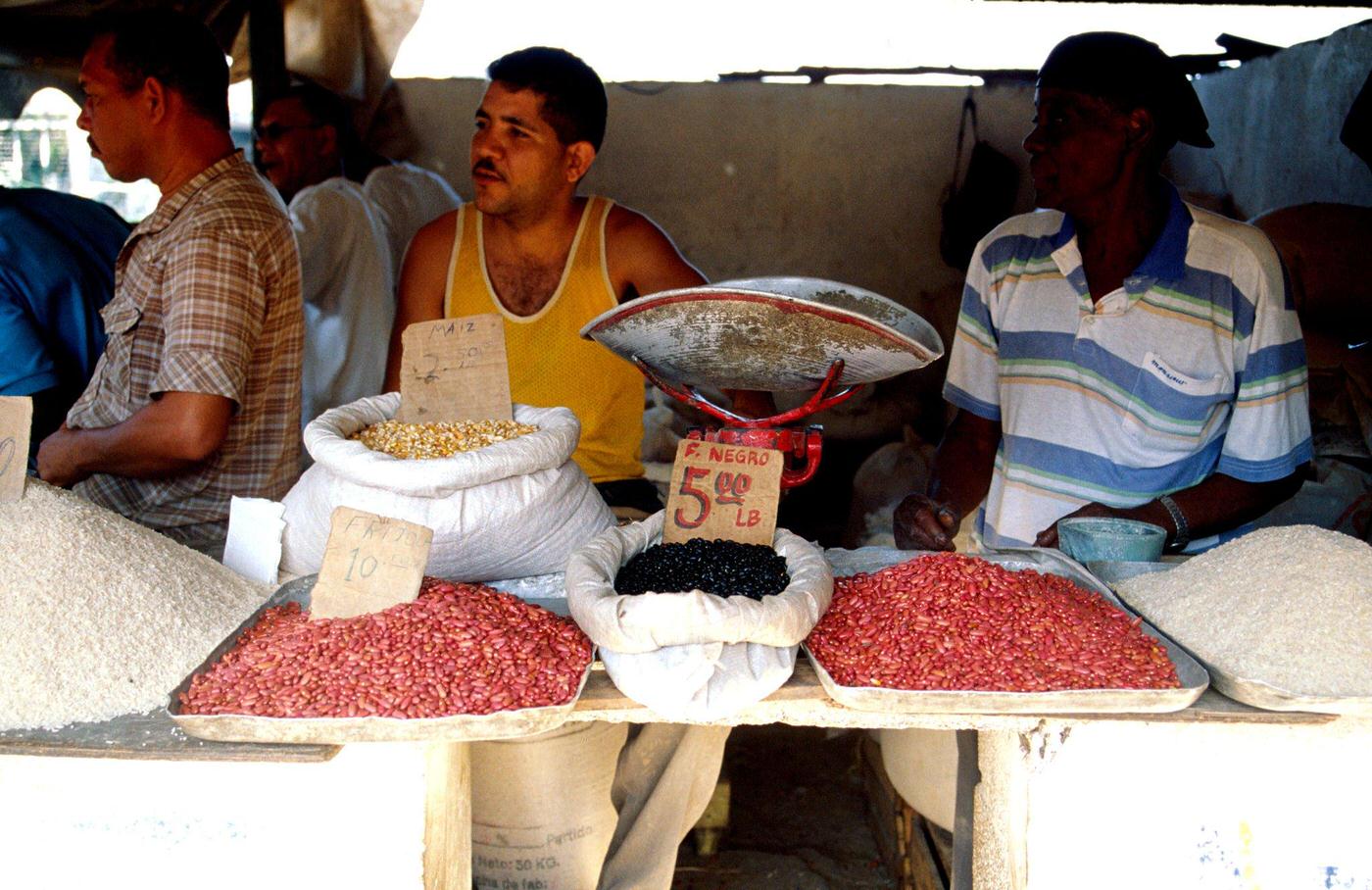 #10 Food market in Santiago de Cuba selling rice, corn, and black beans, 1990s.