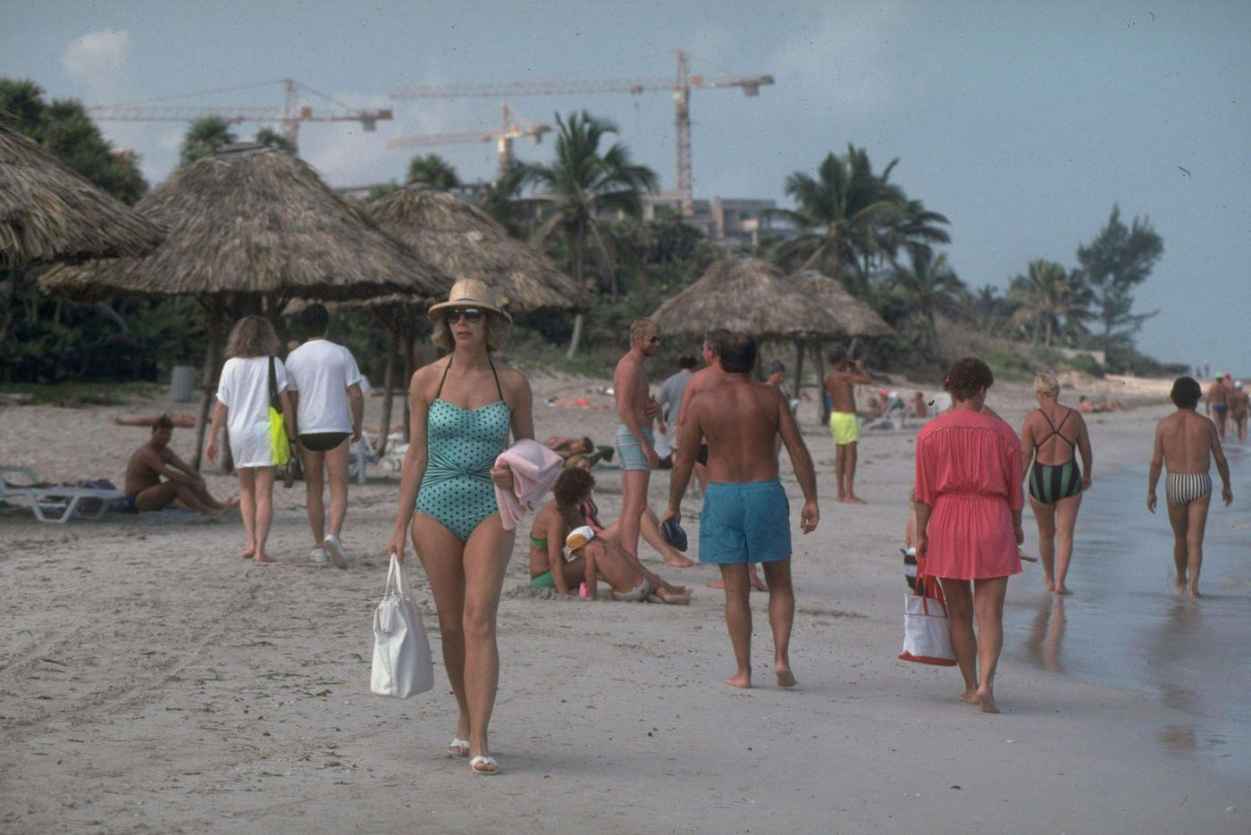 #20 Tourists sunbathing and strolling on the beach in Varadero, Cuba.