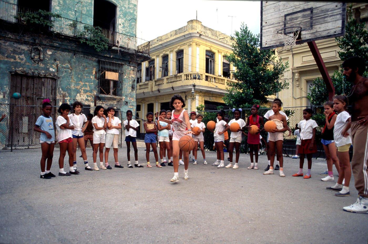 #57 Cuban schoolchildren at a girls’ school practicing basketball in Havana, Cuba, 1991.