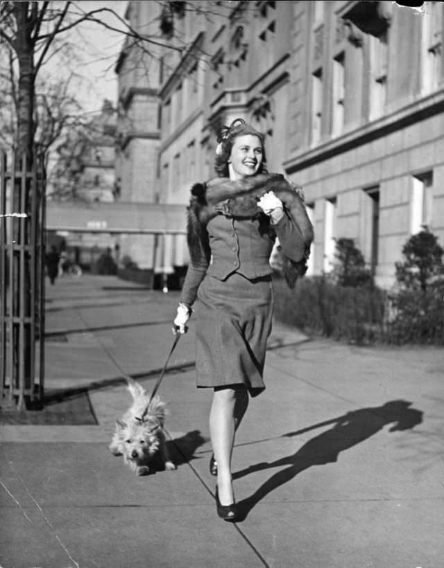 #2 Actress Joan Caulfield briskly walked her West Highland terrier Witty, down Fifth Avenue in New York City, 1944.
