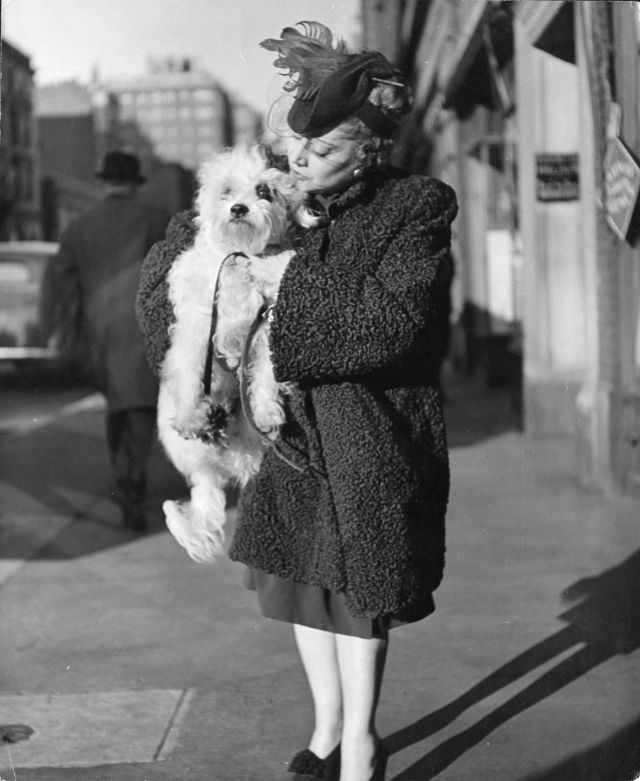 #23 This Maltese poodle/wire-haired terrier mix called Pooch was cuddled by its owner, former Metropolitan Opera singer Thalia Sabaneev, New York City, 1944.