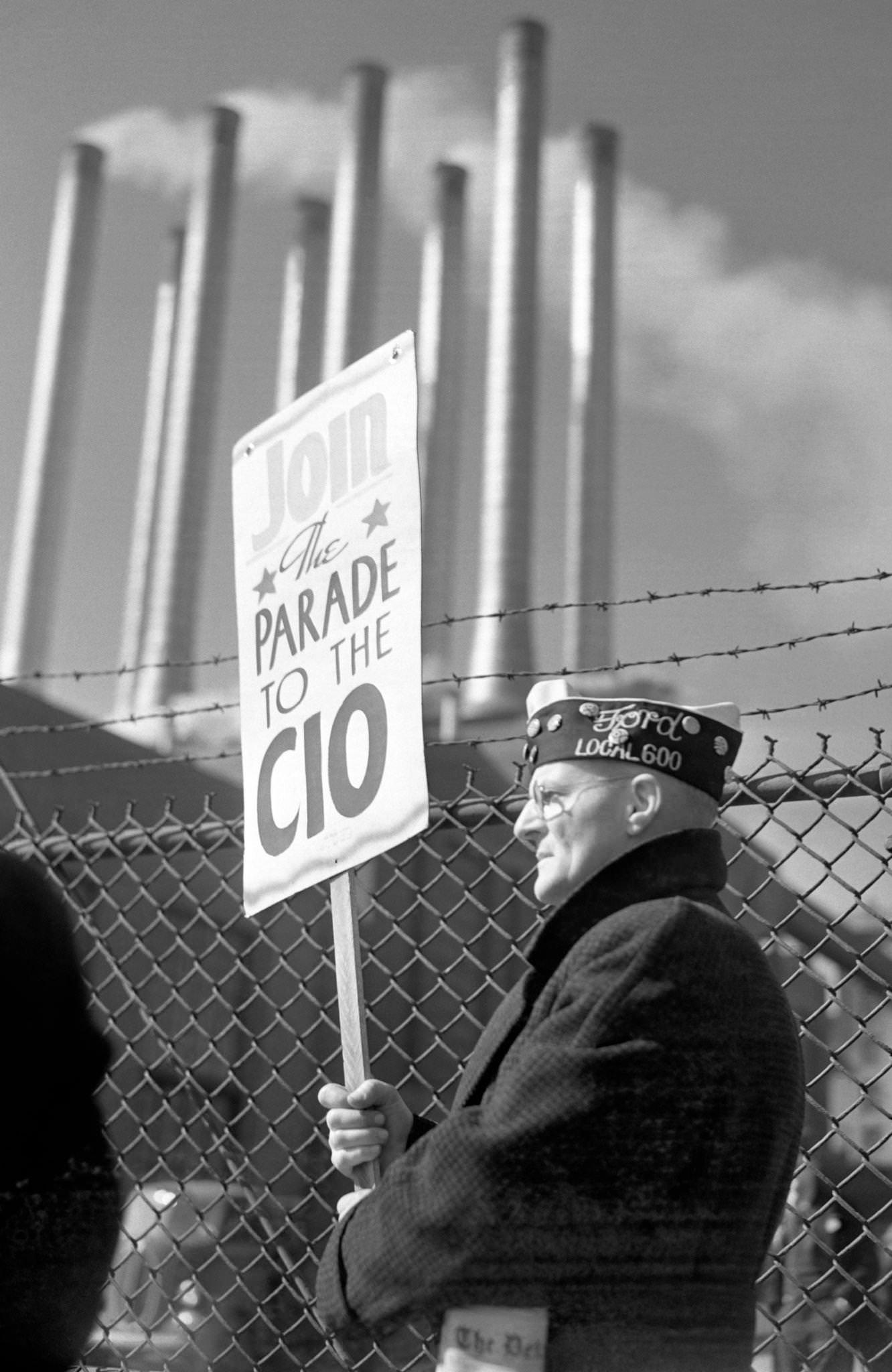 #12 A man walks the picket line during the Ford Motor Company Labor strike at the Ford River Rouge complex in Dearborn, Michigan, April 11, 1941.