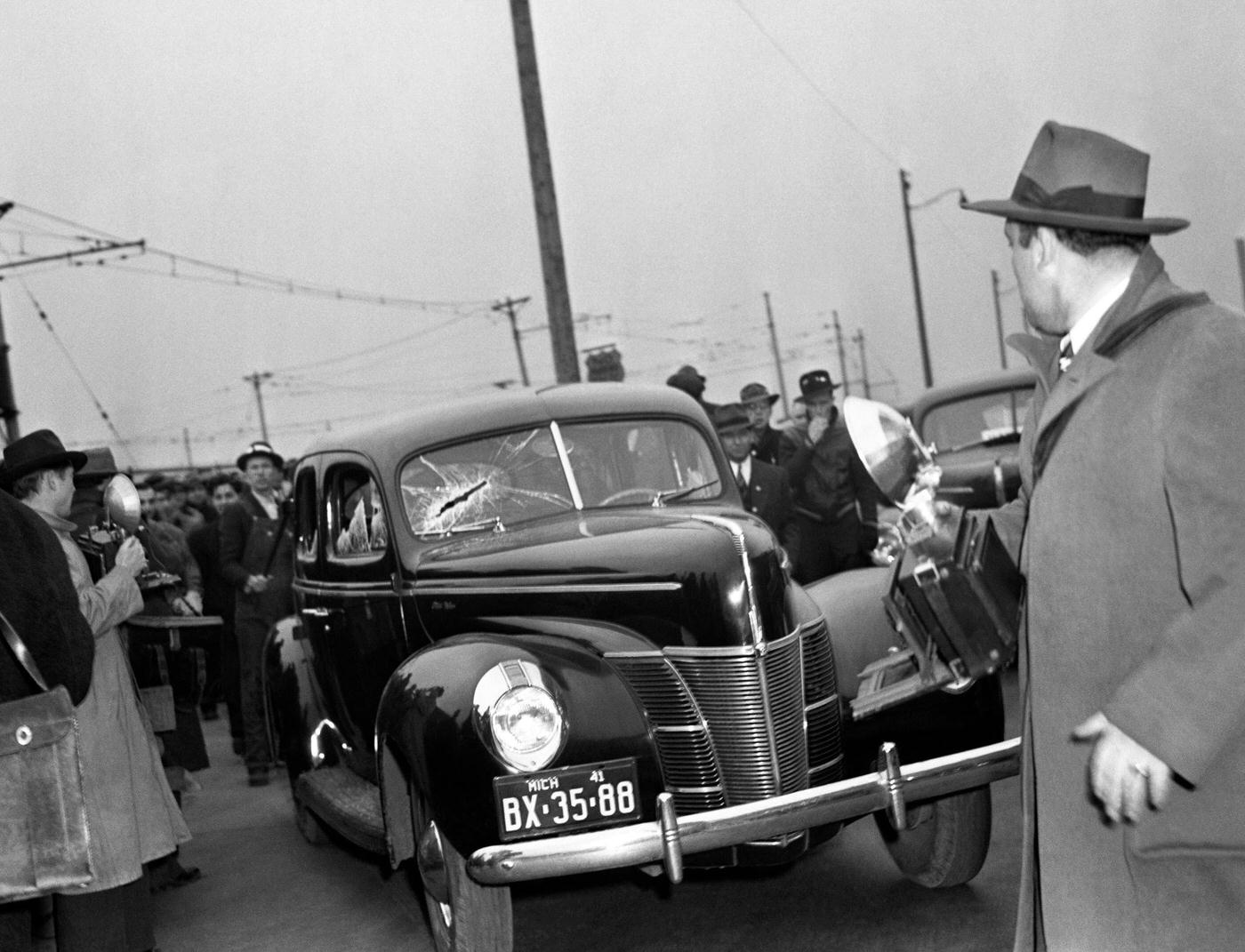 #14 A non striker was taken into custody by state police here, after he and a companion swung at picketers who stopped their car and broke windows in Dearborn, Michigan, April 11, 1941.