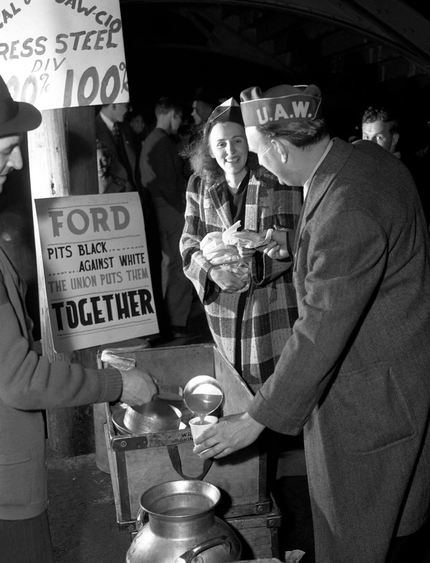 #2 Two United Auto Workers (UAW) get coffee and food during the Detroit Ford Motor Company strike near the Ford River Rouge complex in Dearborn, Michigan, April 1941.