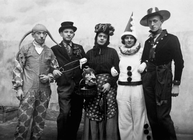 #1 Early 20th-century partygoers pose for a Halloween photo.
