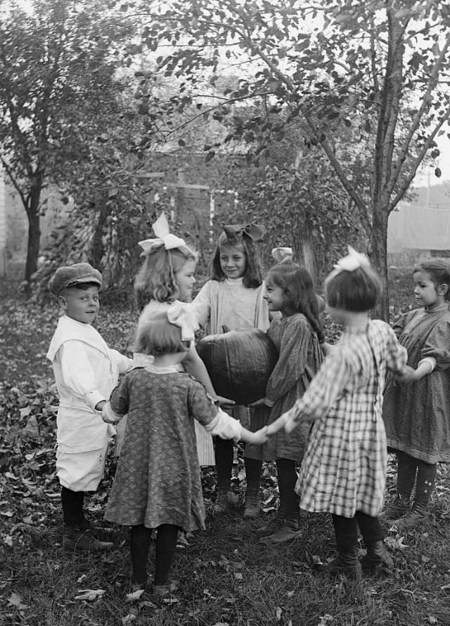 #4 Children playing pumpkin ring toss, 1925.