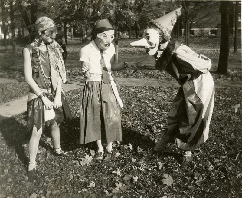 #5 Three girls wearing masked costumes in Cincinnati, Ohio, 1929.