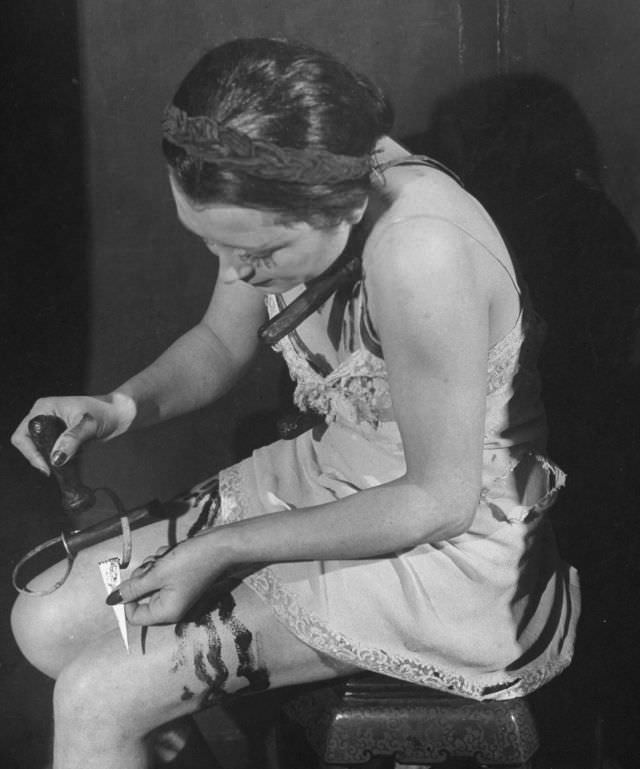 #16 Actress working with a stabbing knife, used for trick in production at the Grand Guignol Theater.