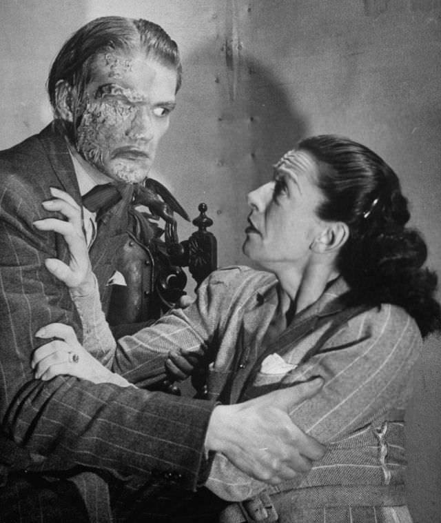 #3 Actors reenacting scene with frightened woman and a man with facial burns, in production at the Grand Guignol Theater.