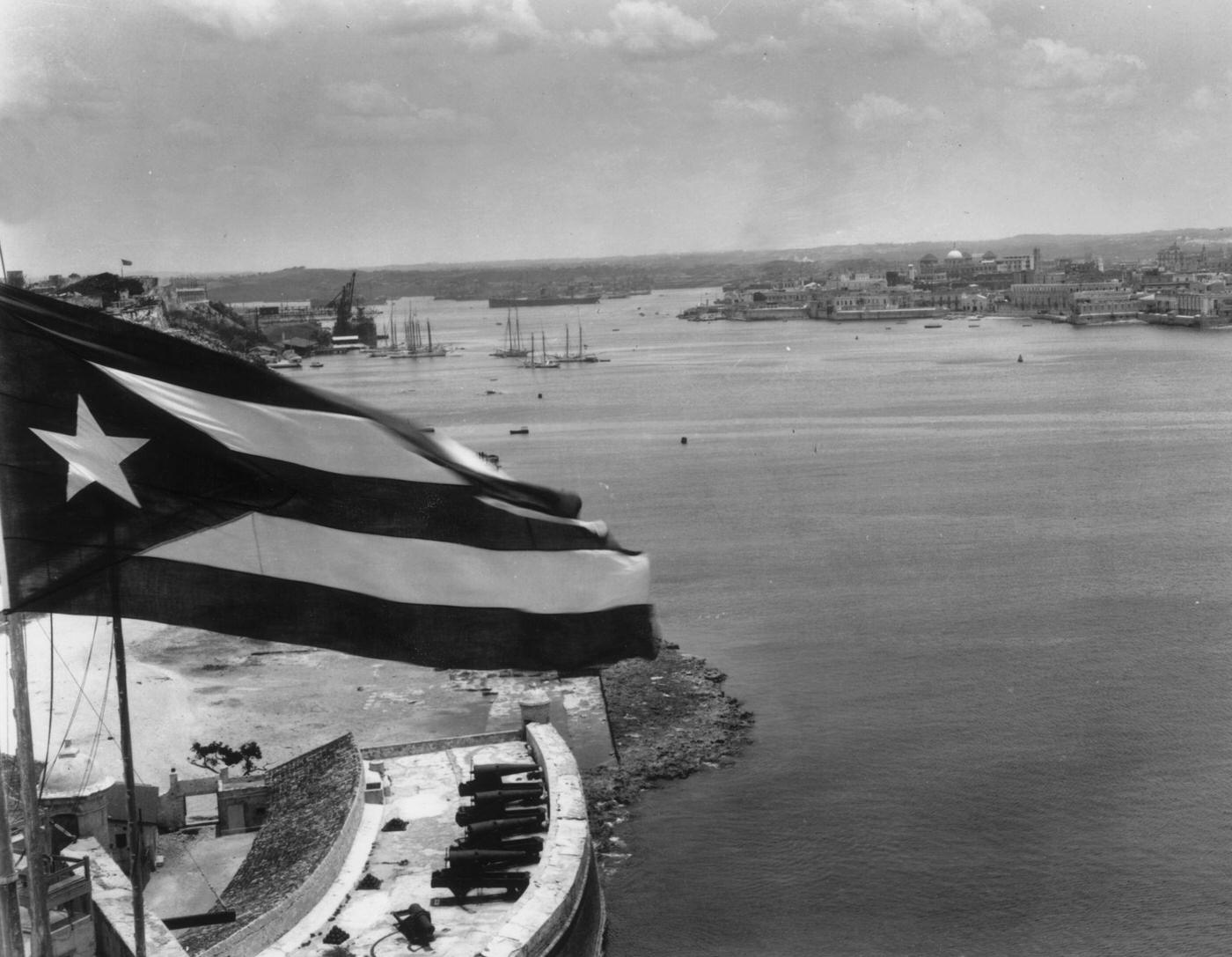 #17 Cuban flag flying above the chief port and capital, Havana, 1934