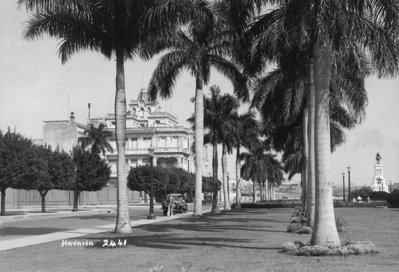 #22 Palm trees edge a street in Havana, capital of Cuba, 1938