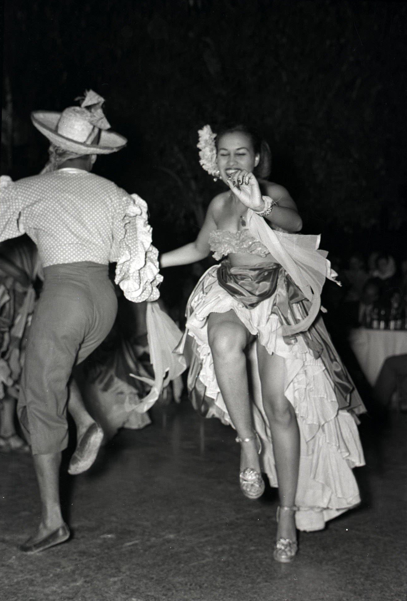 #9 Costumed dancers perform in a floor show at the Tropicana nightclub in Havana, 1930