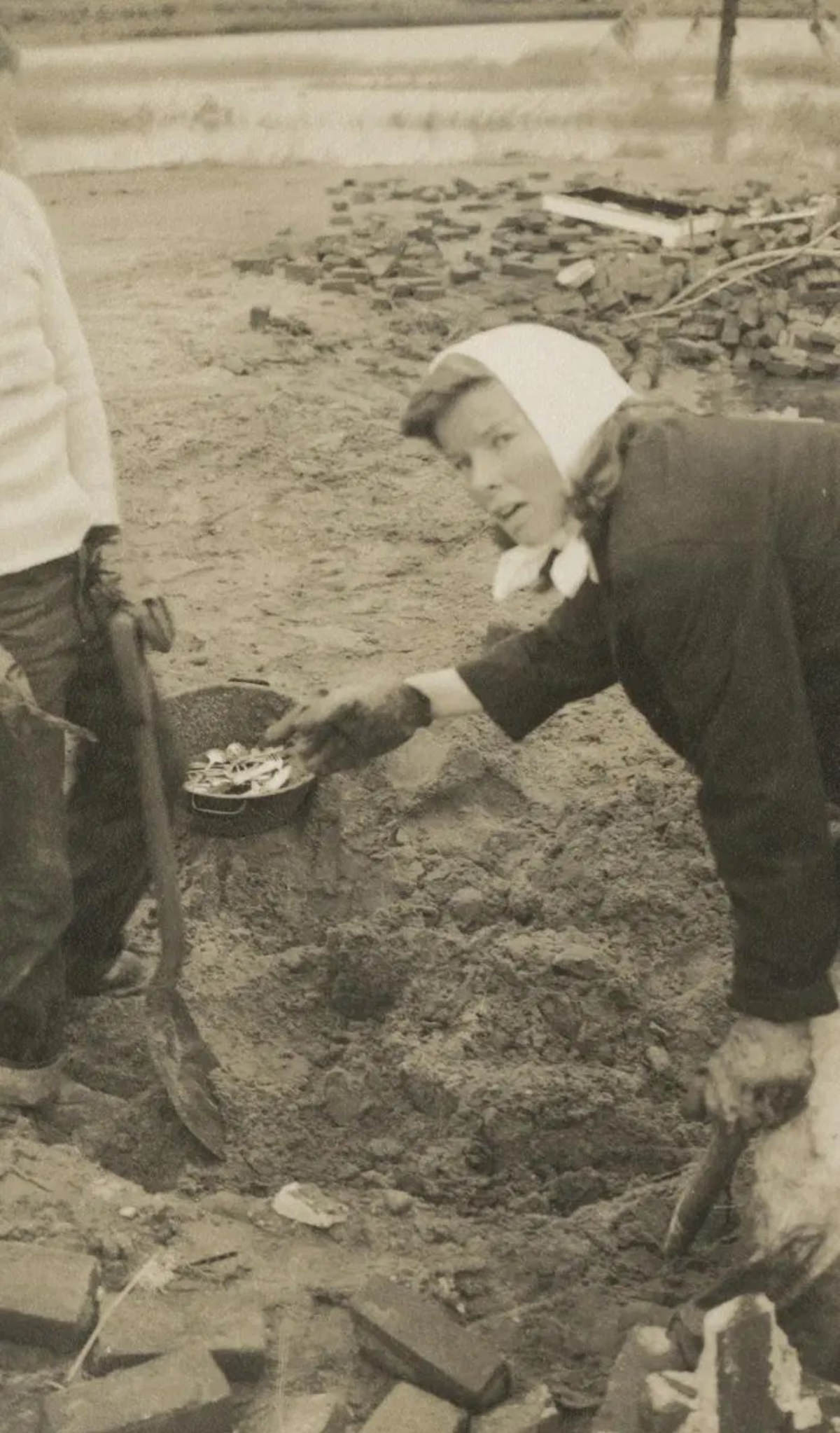 #5 Katharine Hepburn digging through the debris of her home after the 1938 hurricane.