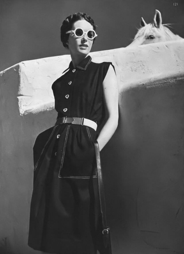 #11 Model in spun-rayon-cotton dress with white stitiching and canvas belt by Townley, Arizona, Vogue, 1945.