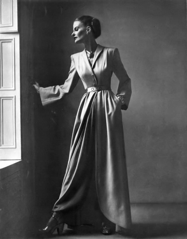 #14 Dorothy Tivis in egg-nog beige wool cut-away hostess coat by Joseph Whitehead for Bergdorf Goodman, Vogue, 1946.