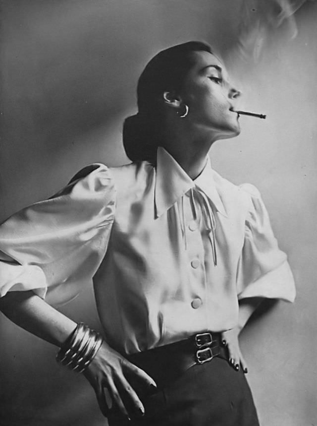 #17 Model in silk shantung blouse with extravagantly full sleeves, Vogue, 1946.